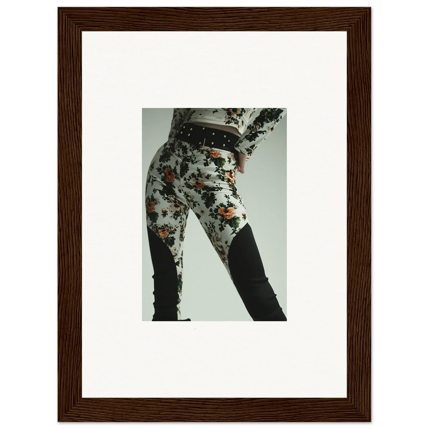 Framed photograph of a person wearing patterned pants.