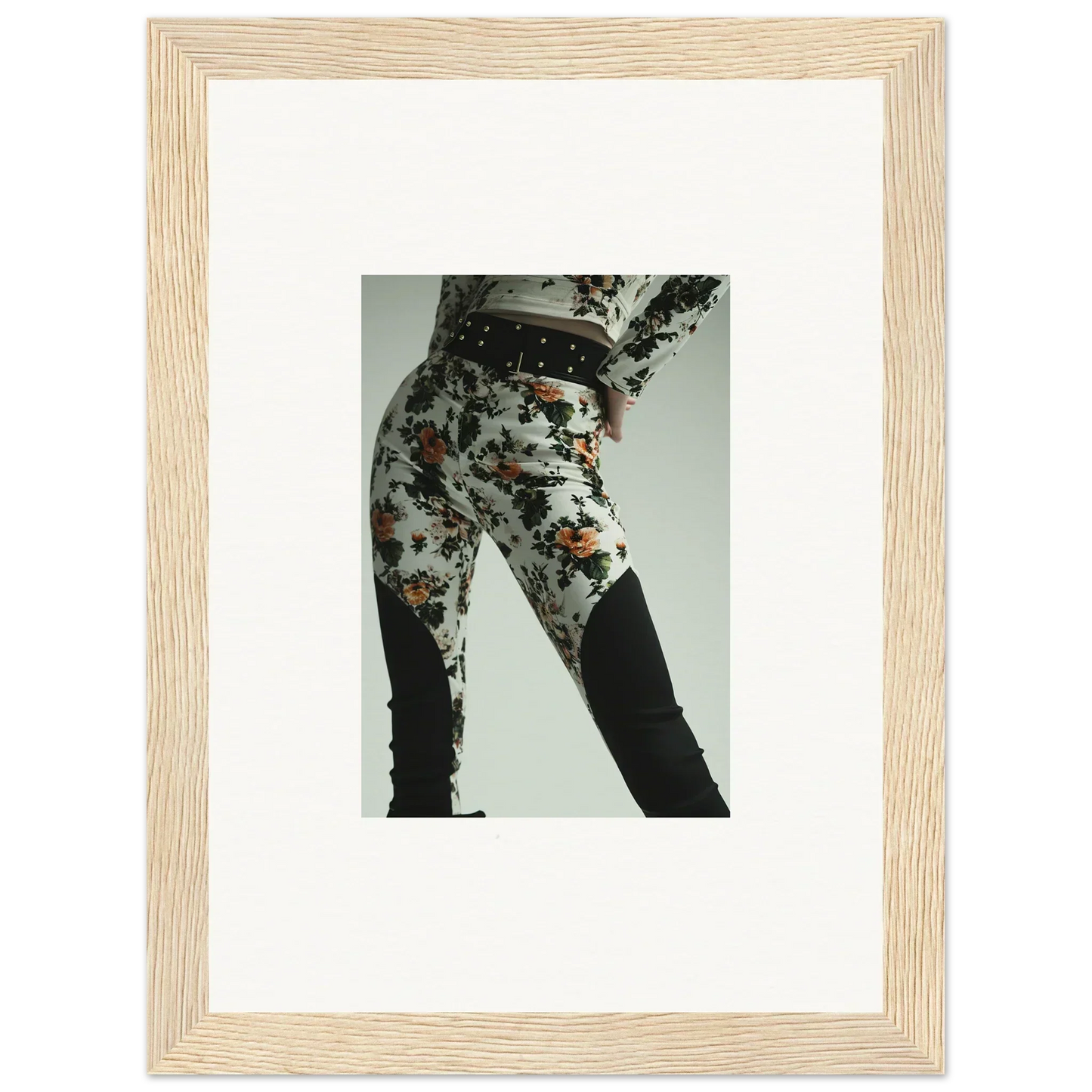 Framed photograph of a person wearing patterned pants.