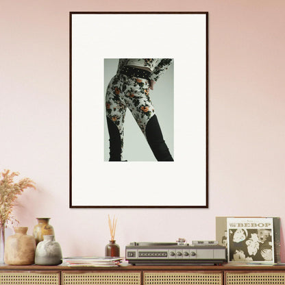 Framed photograph of floral-patterned pants on a person’s lower body.