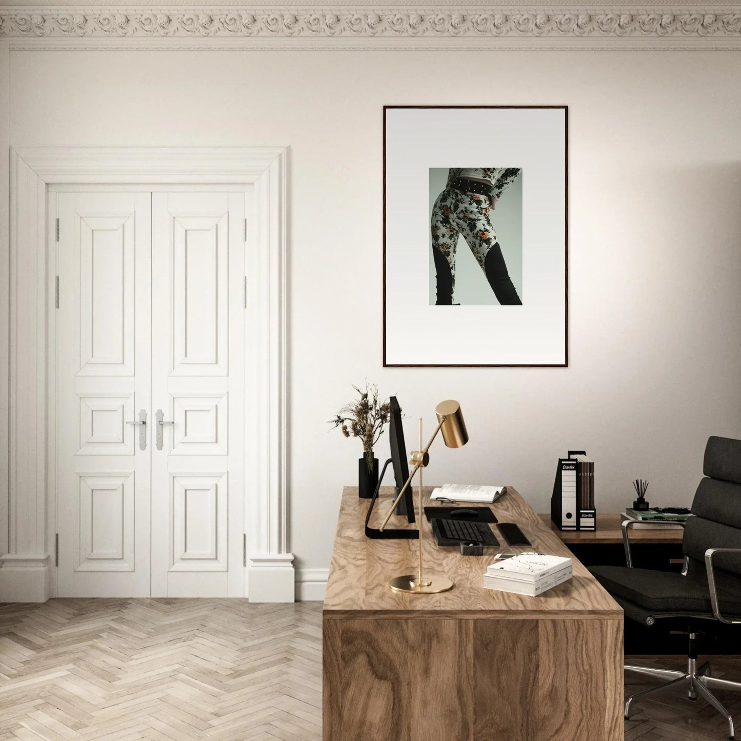 Wooden desk with a typewriter, books, and office accessories in a minimalist workspace.