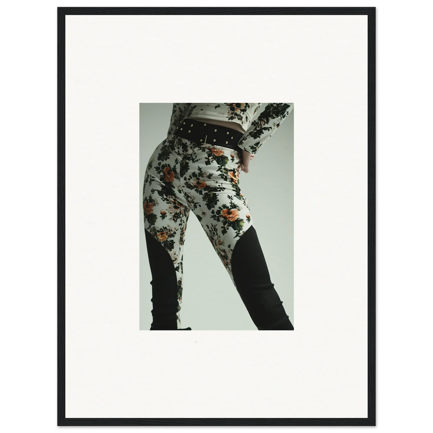 Pair of patterned leggings or tight pants with floral designs.