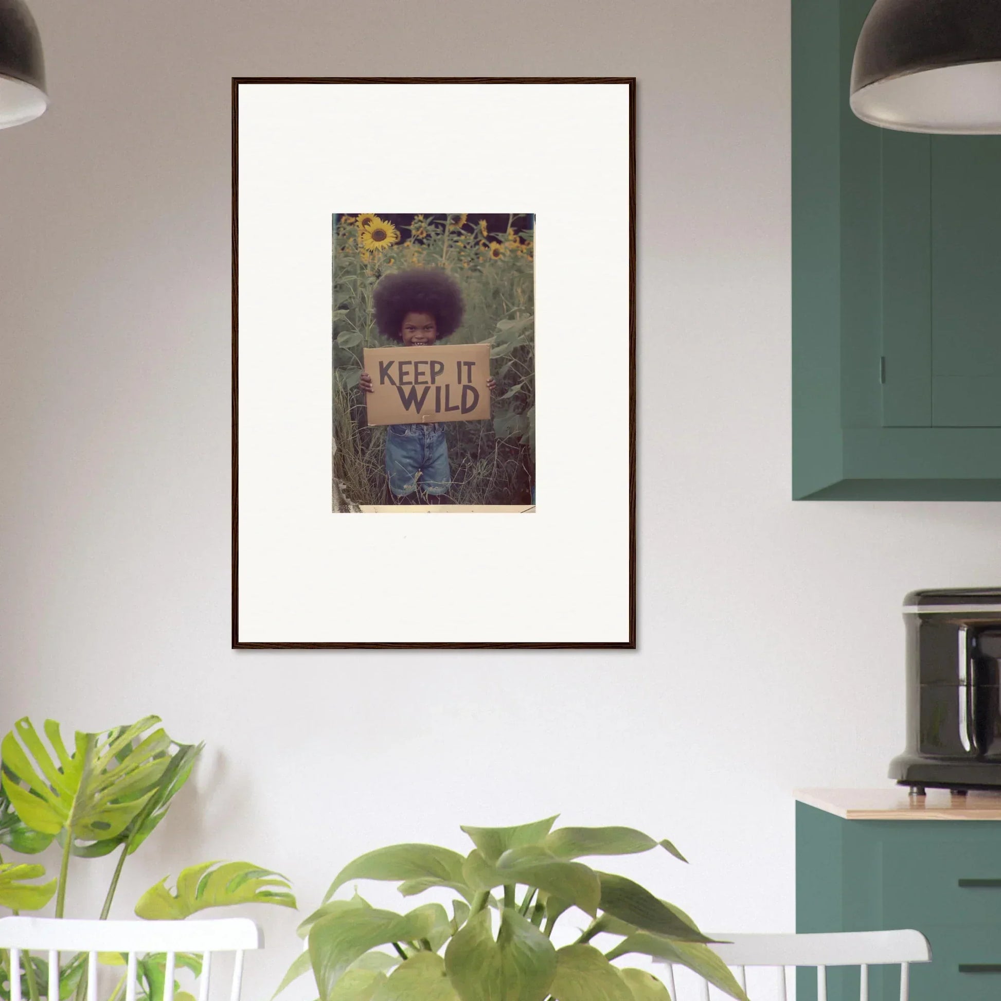 Framed canvas print of a person holding a KEEP IT WILD sign for room decoration