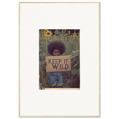 Framed photo of a person with a KEEP IT WILD sign among sunflowers for room decoration