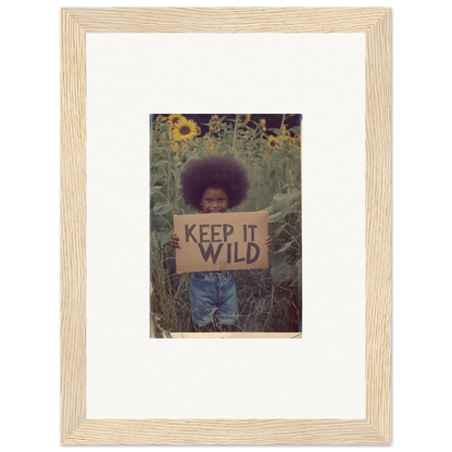 Framed photo of person with KEEP IT WILD sign in sunflower field for room decoration