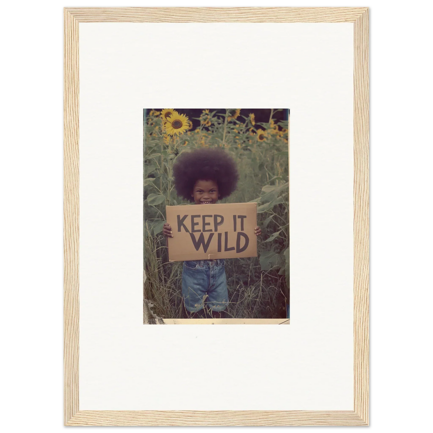 Person with a KEEP IT WILD sign in sunflowers, perfect for room decoration or canvas print