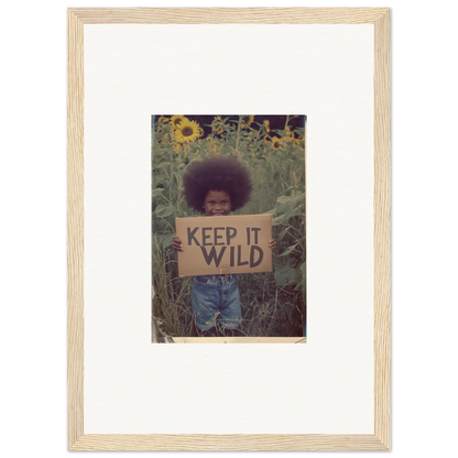 Person with a KEEP IT WILD sign in sunflowers, perfect for room decoration or canvas print