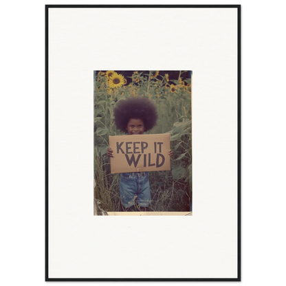 Framed photo of a person with a KEEP IT WILD sign, perfect for room decoration