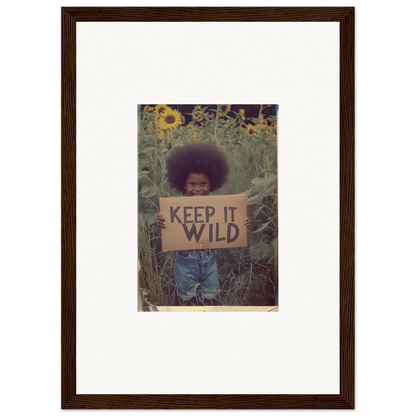 Framed photo of a person with a KEEP IT WILD sign, perfect for room decoration