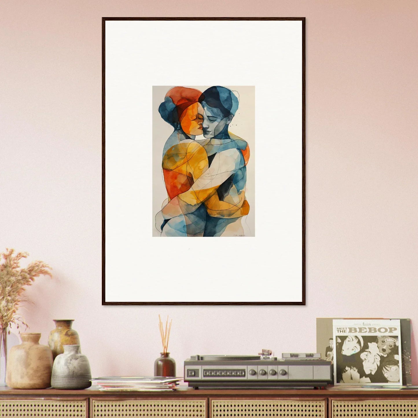 Framed wall art of Fluid Souls Embrace featuring blue and orange figures for room decor