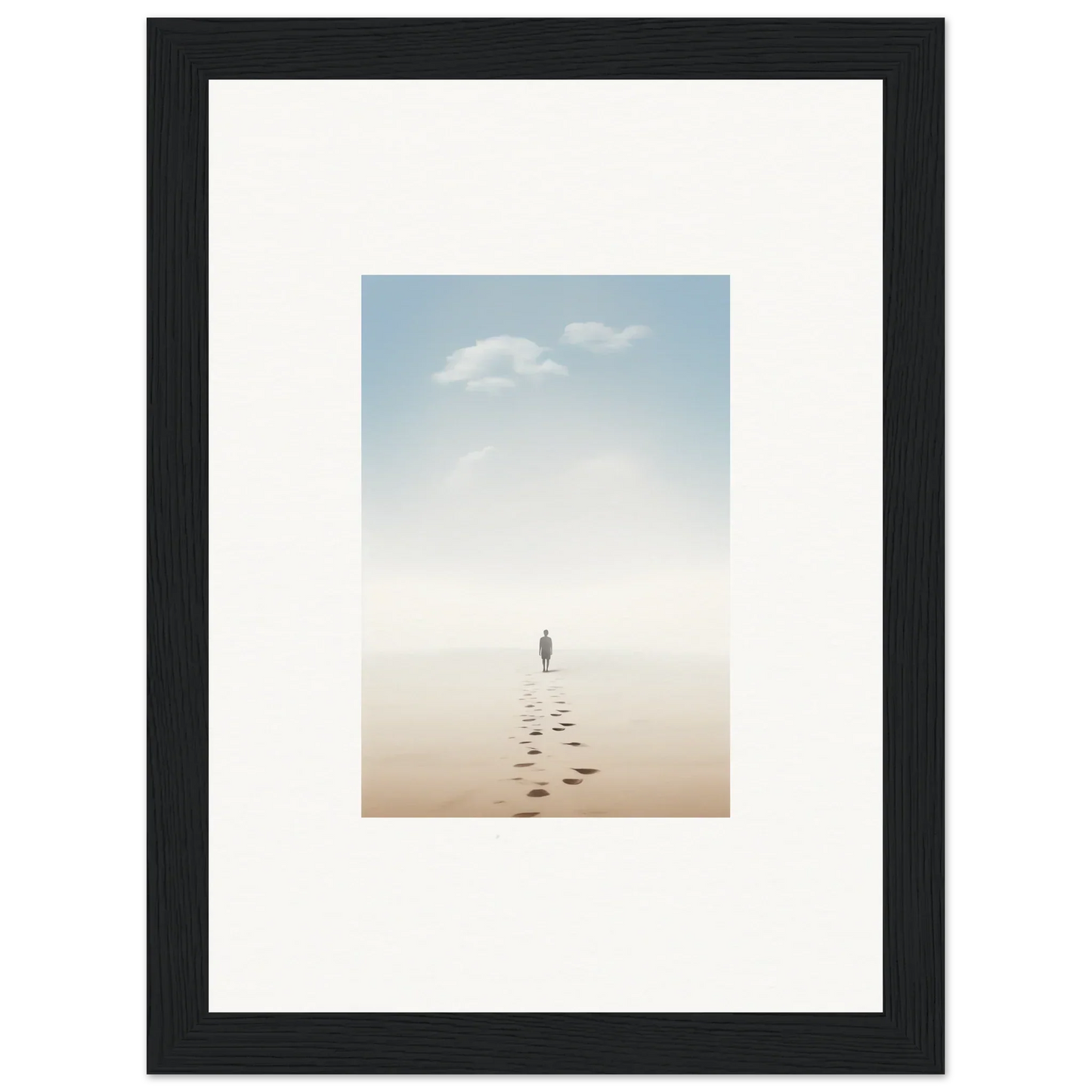 Framed wall art of a solitary figure on a misty beach evokes entwined nostalgia