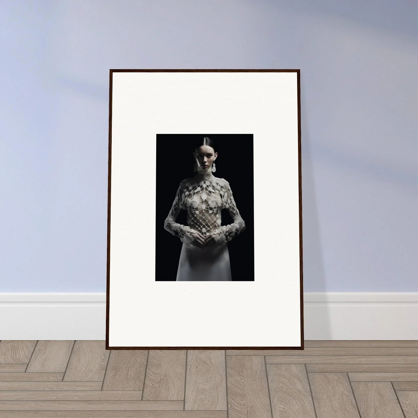 Framed black and white photograph of a figure with an unusual skull head for etheris dress room decor