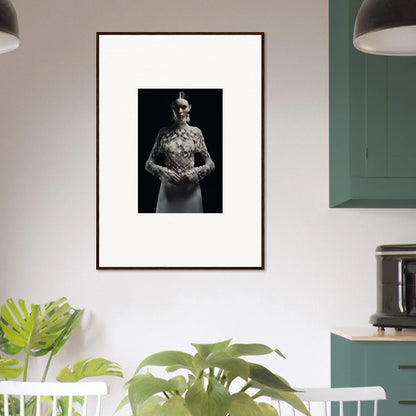 Framed black and white wall art featuring a person in formal attire with flowers for room decor