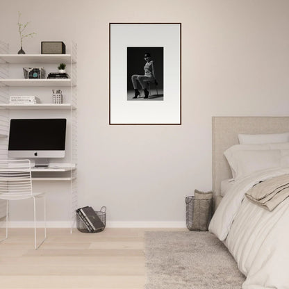 Minimalist bedroom with white walls, floating shelves, and a framed black and white photograph.