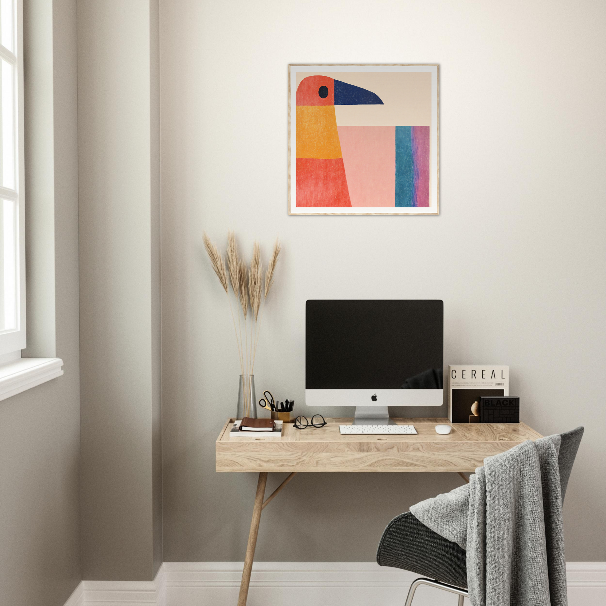 Minimalist wooden desk featuring an iMac and Geometric Toucan Contemplation artwork