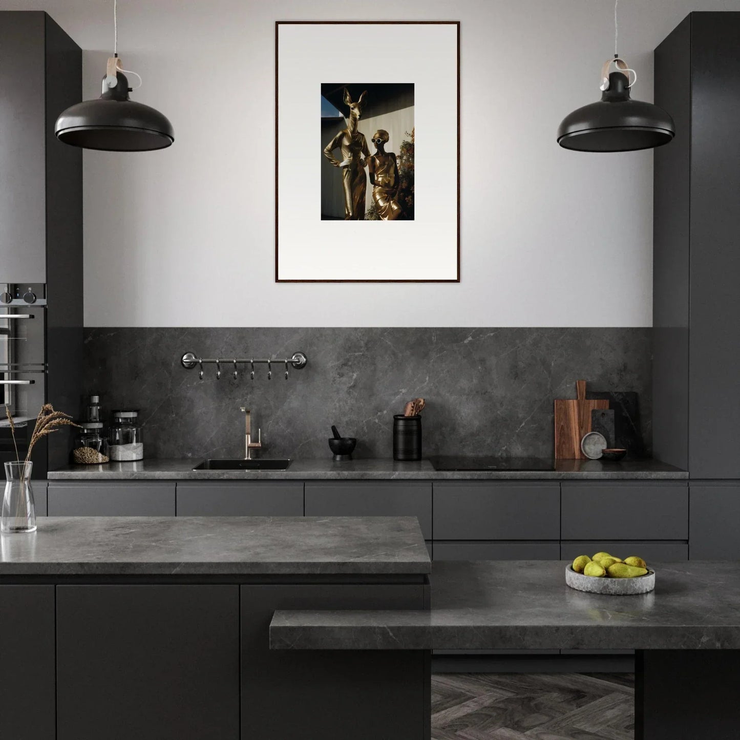 Modern kitchen with dark cabinetry, pendant lights, and framed artwork on the wall.