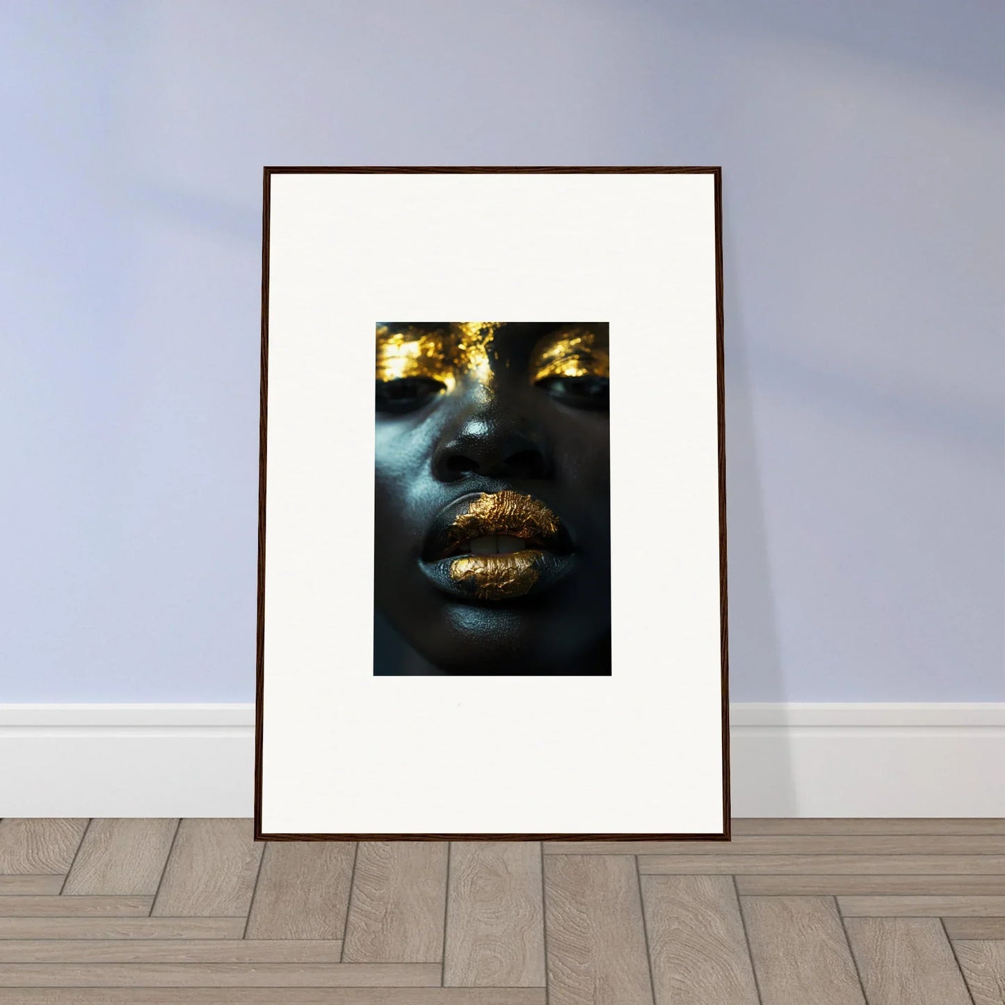 Framed canvas print of a close-up portrait with golden accents for room decoration