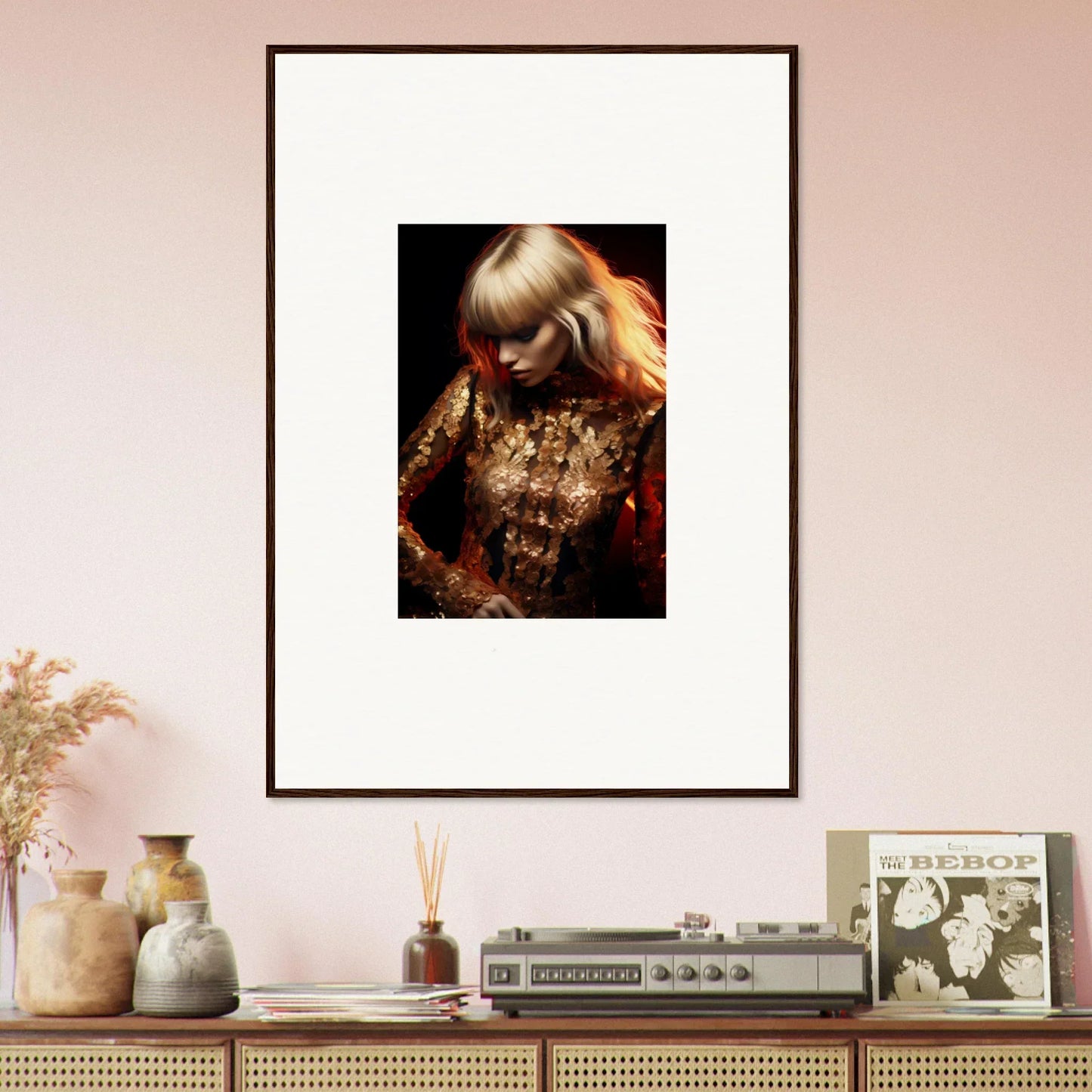 Framed portrait photograph of a woman with blonde hair wearing a glittering gold outfit.