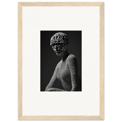 Black and white photograph of a sculptural bust wearing an ornate headdress and textured garment.