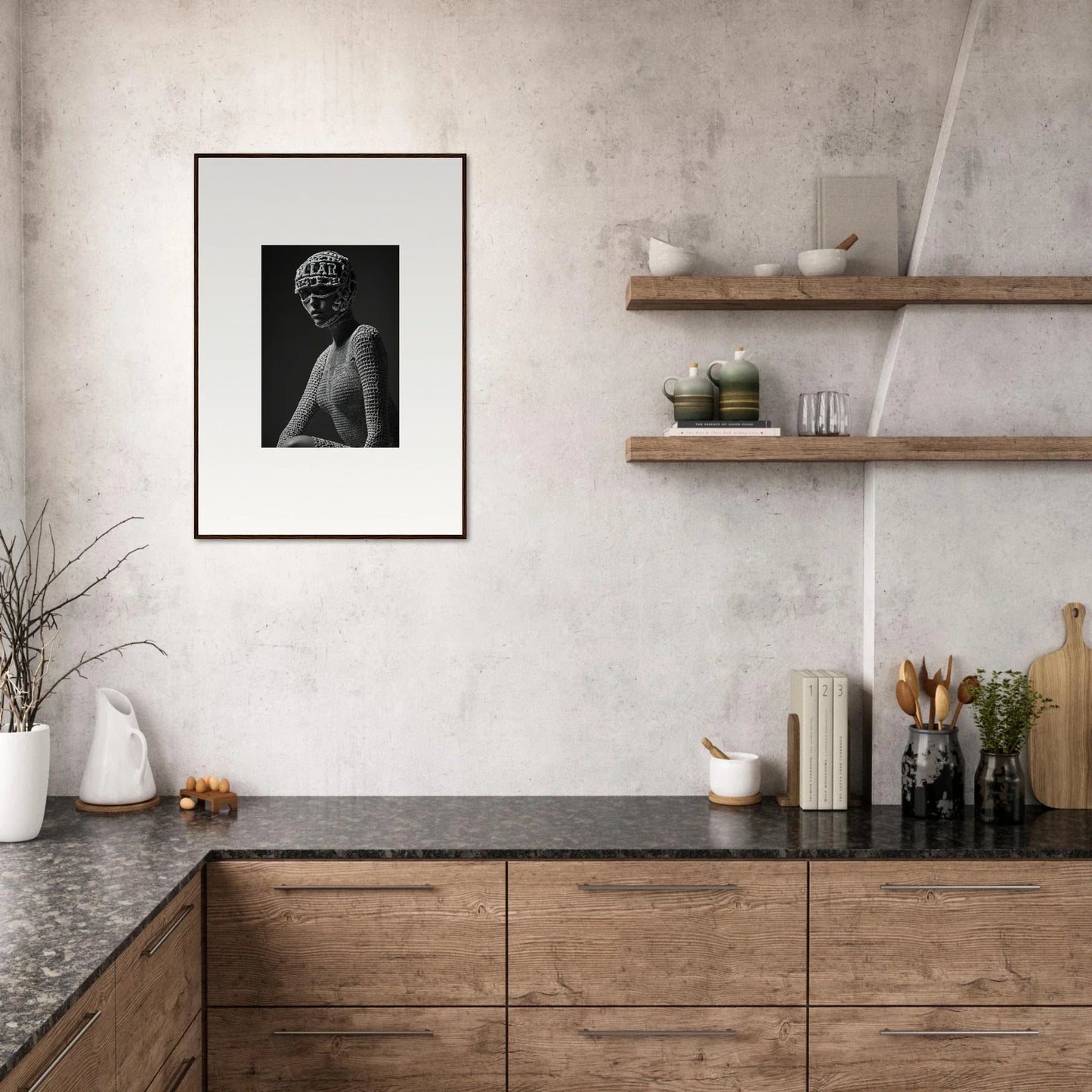 Modern kitchen with wooden cabinetry, dark countertops, and minimalist decor including floating shelves and a framed black and white photograph.