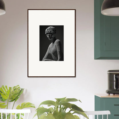 Framed black and white portrait of a person wearing a textured top and a short, curly hairstyle.