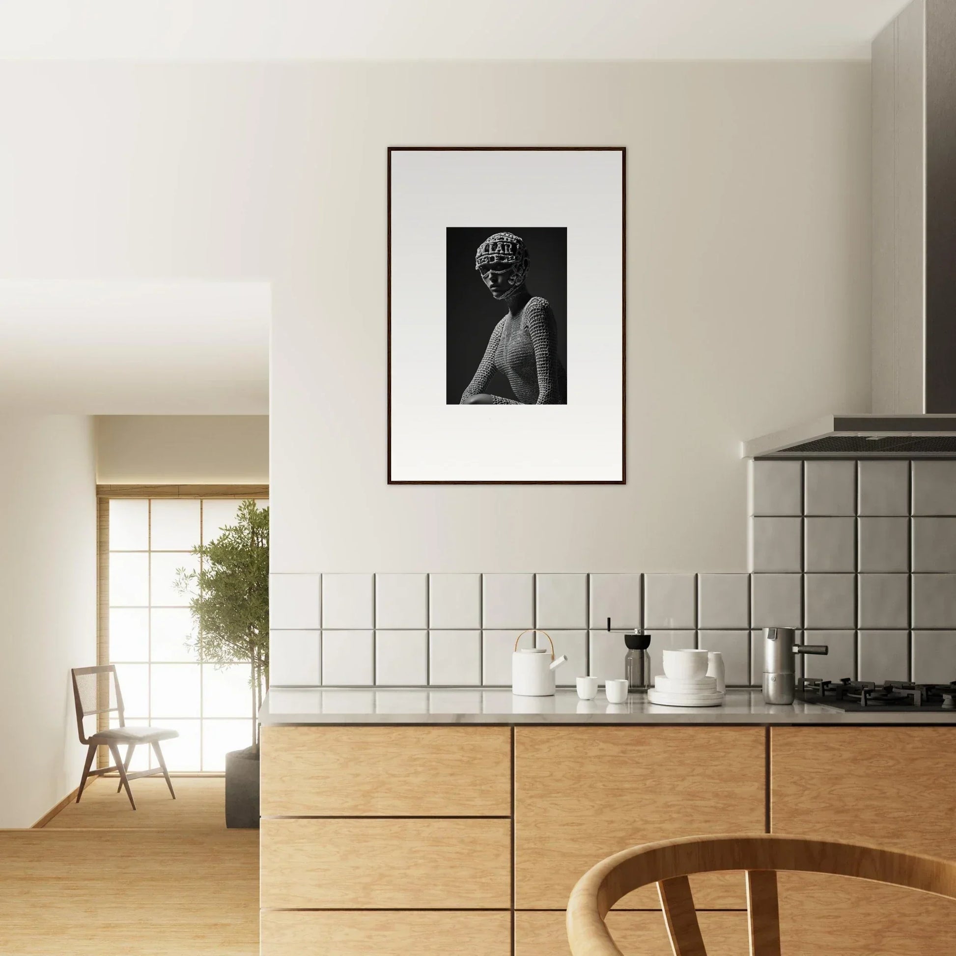 Modern kitchen with wooden cabinetry and a framed black and white photograph on the wall.