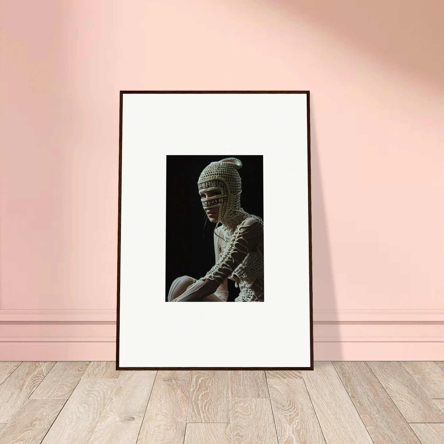 Framed black and white photograph of a bandaged figure.