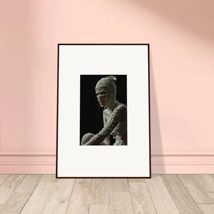 Framed black and white photograph of a bandaged figure.