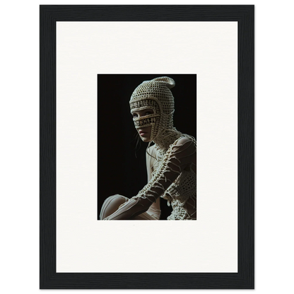 Framed photograph of a sculpture depicting a figure wearing an ornate chainmail-like headdress.