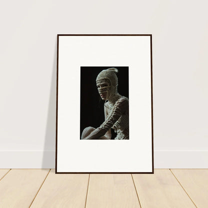 Framed black and white photograph of a mummy-like figure.