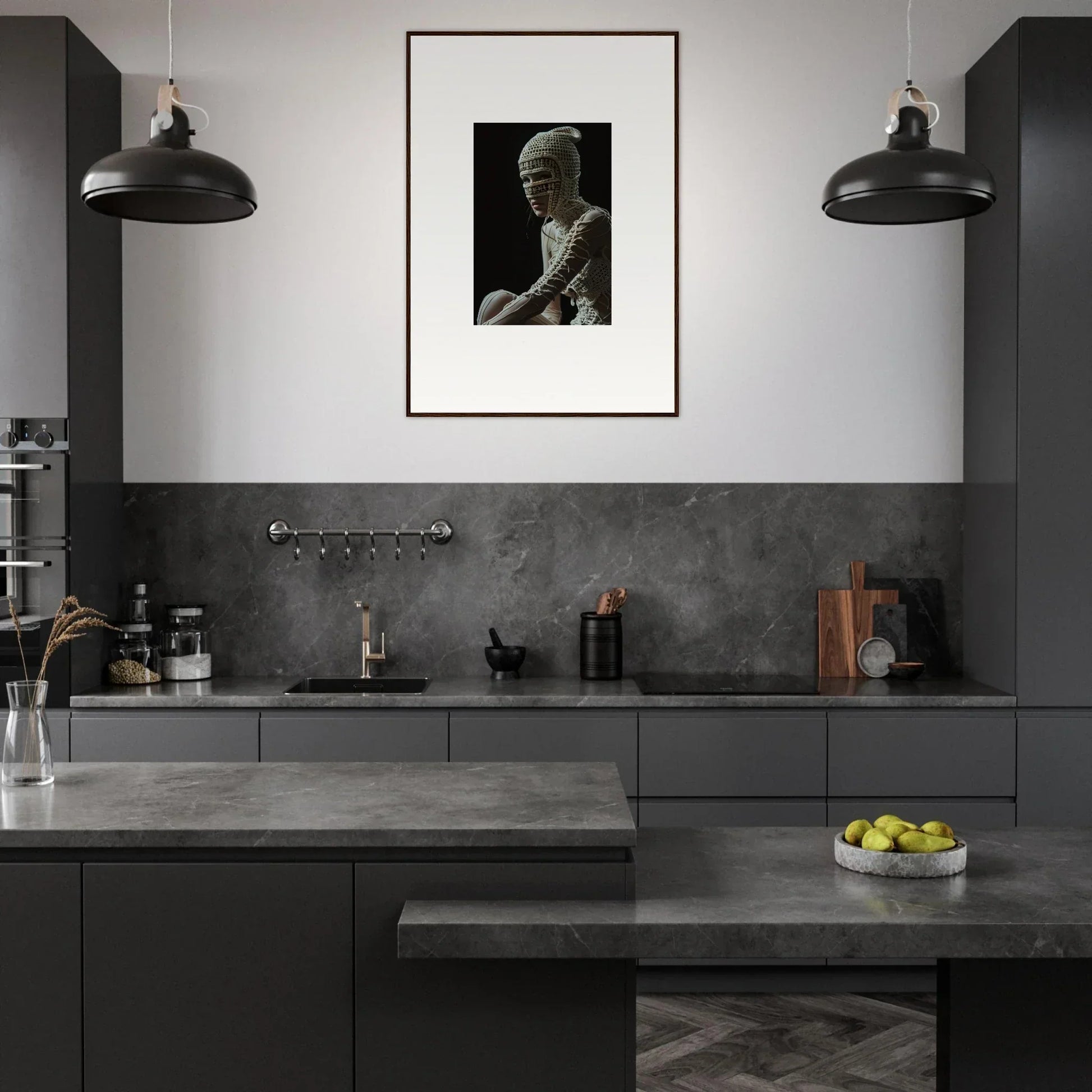 Modern kitchen with dark gray cabinetry and a framed black-and-white photograph on the wall.