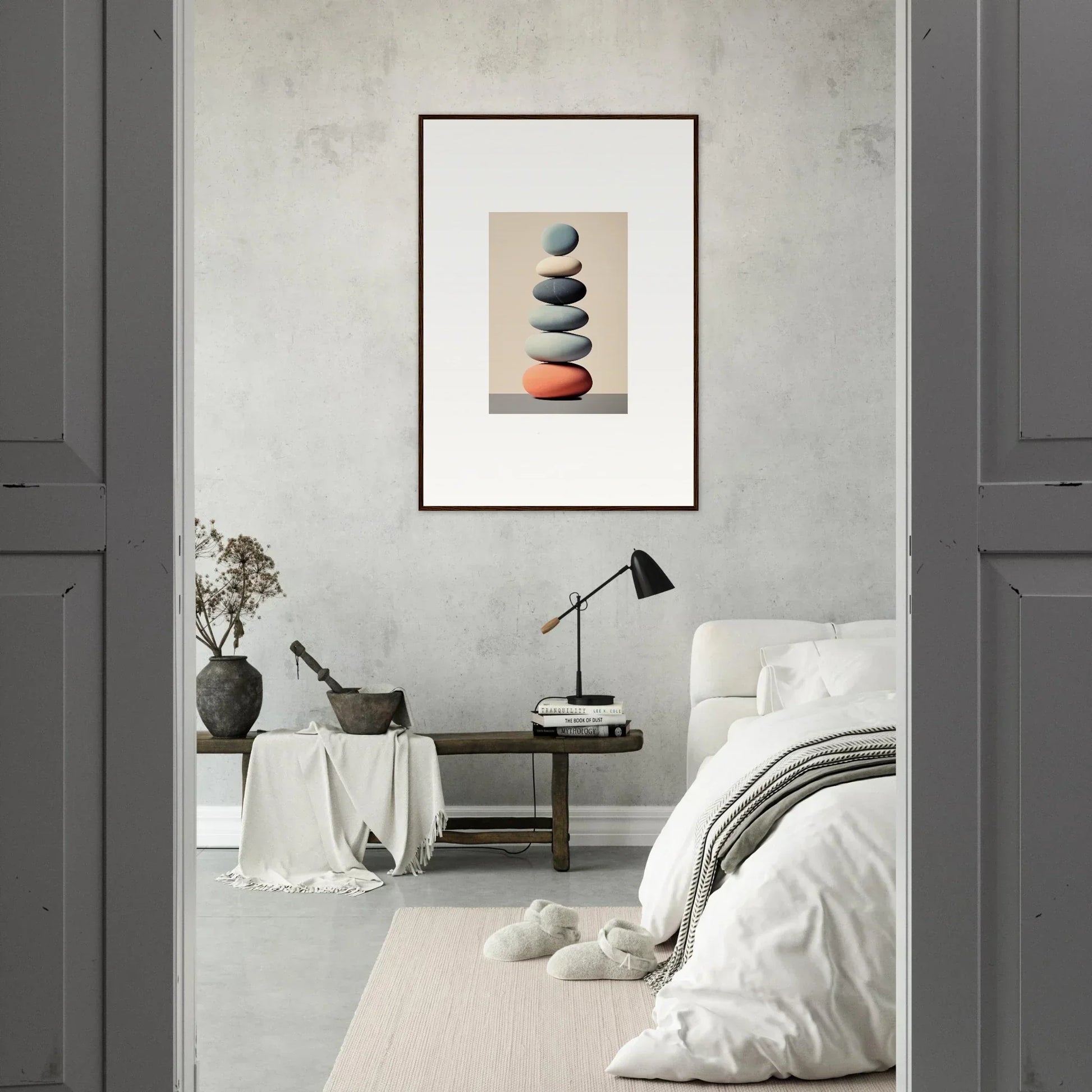 Framed canvas print of stacked stones, featuring a red one for stylish room decoration