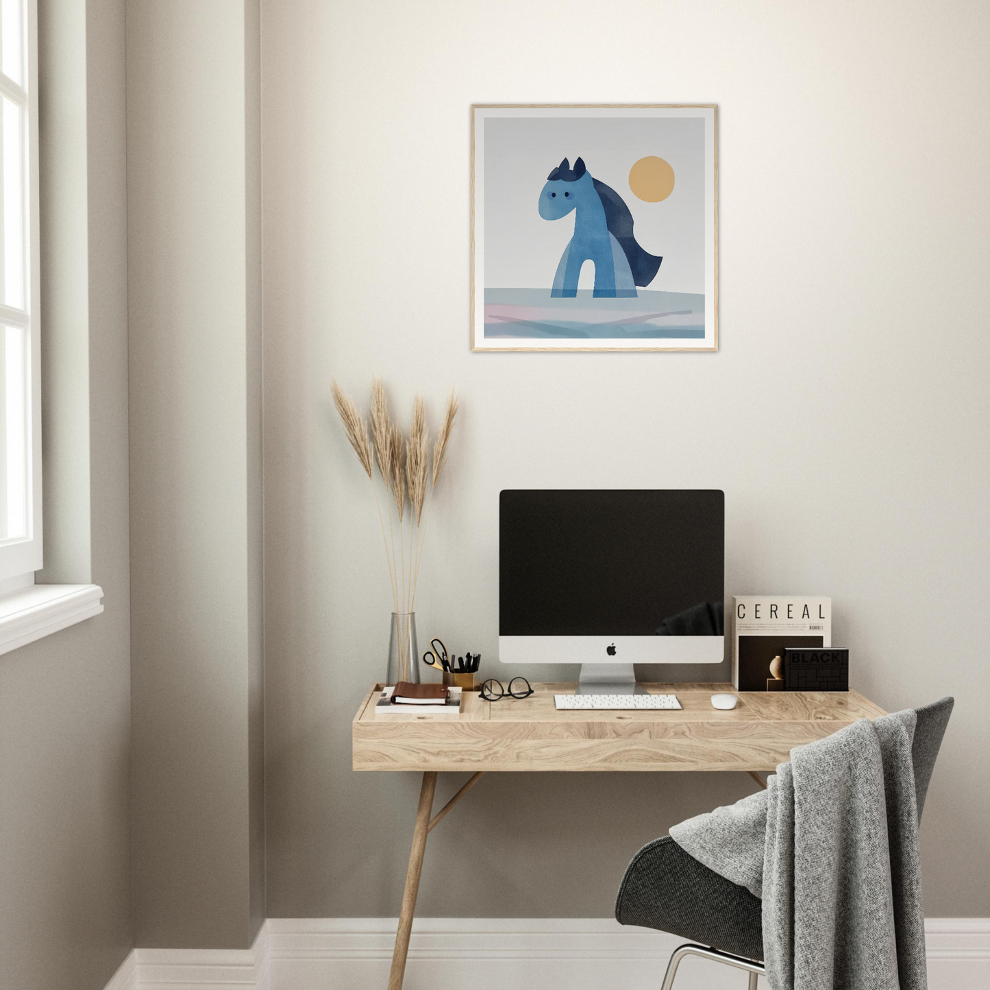 Minimalist wooden desk featuring an iMac, styled with Hues Trot Souls artwork above