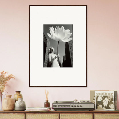 Framed black and white photo of a person near a giant flower for bloom reverie decor