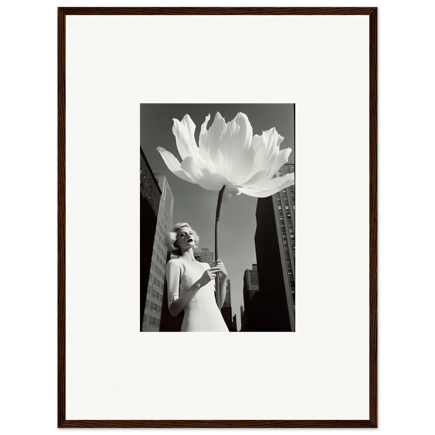 Black and white photograph of a woman beside an oversized flower for bloom reverie canvas print