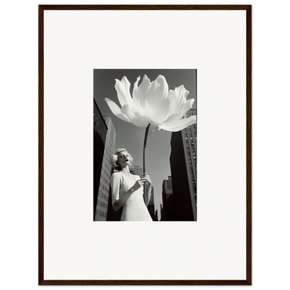 Black and white photograph of a woman beside an oversized flower for bloom reverie canvas print