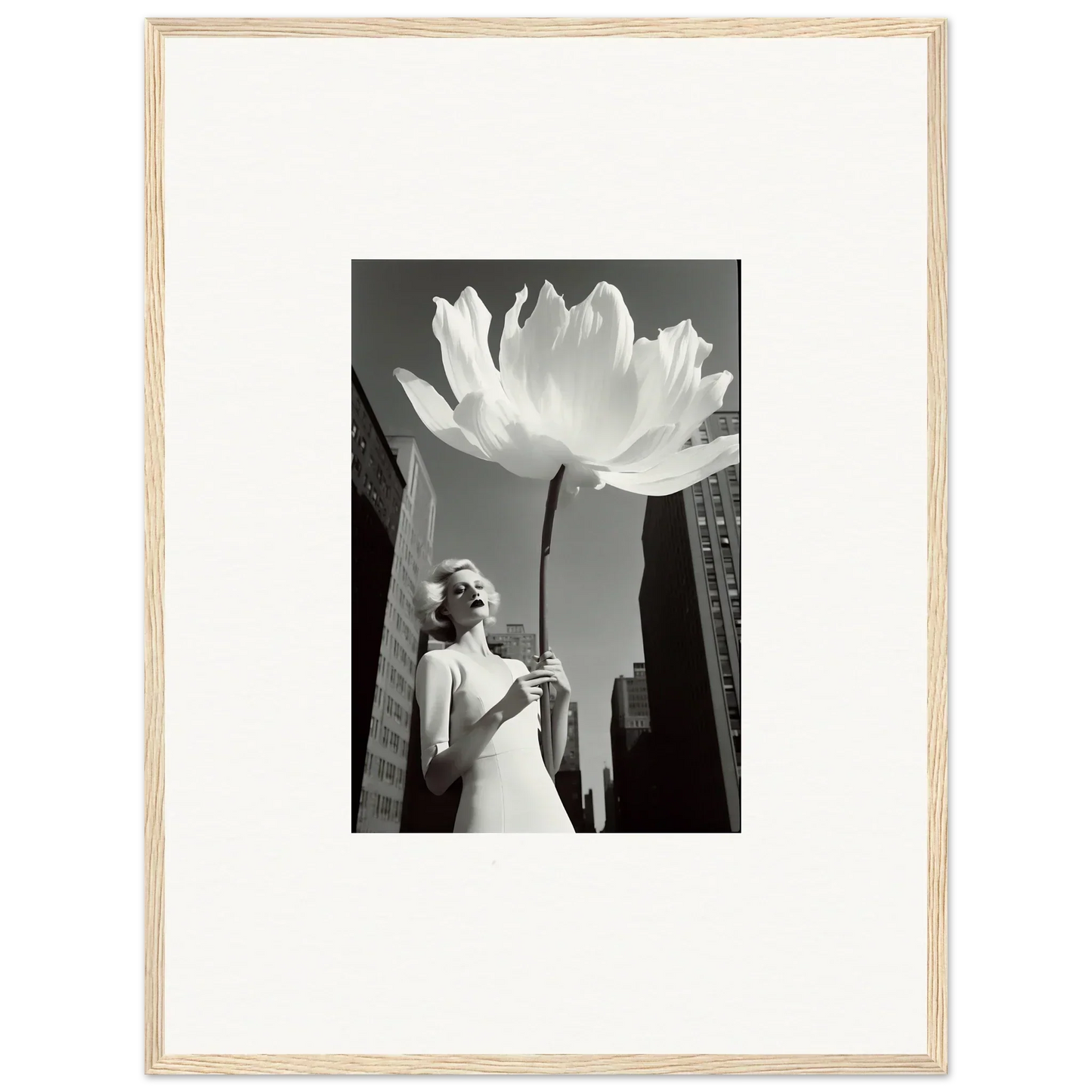 Black and white image of a woman by a giant flower for your bloom reverie canvas print decor