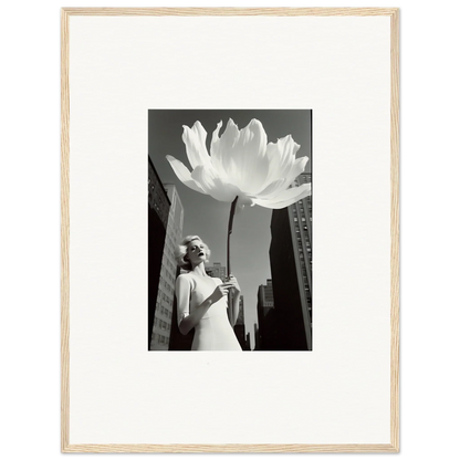 Black and white image of a woman by a giant flower for your bloom reverie canvas print decor