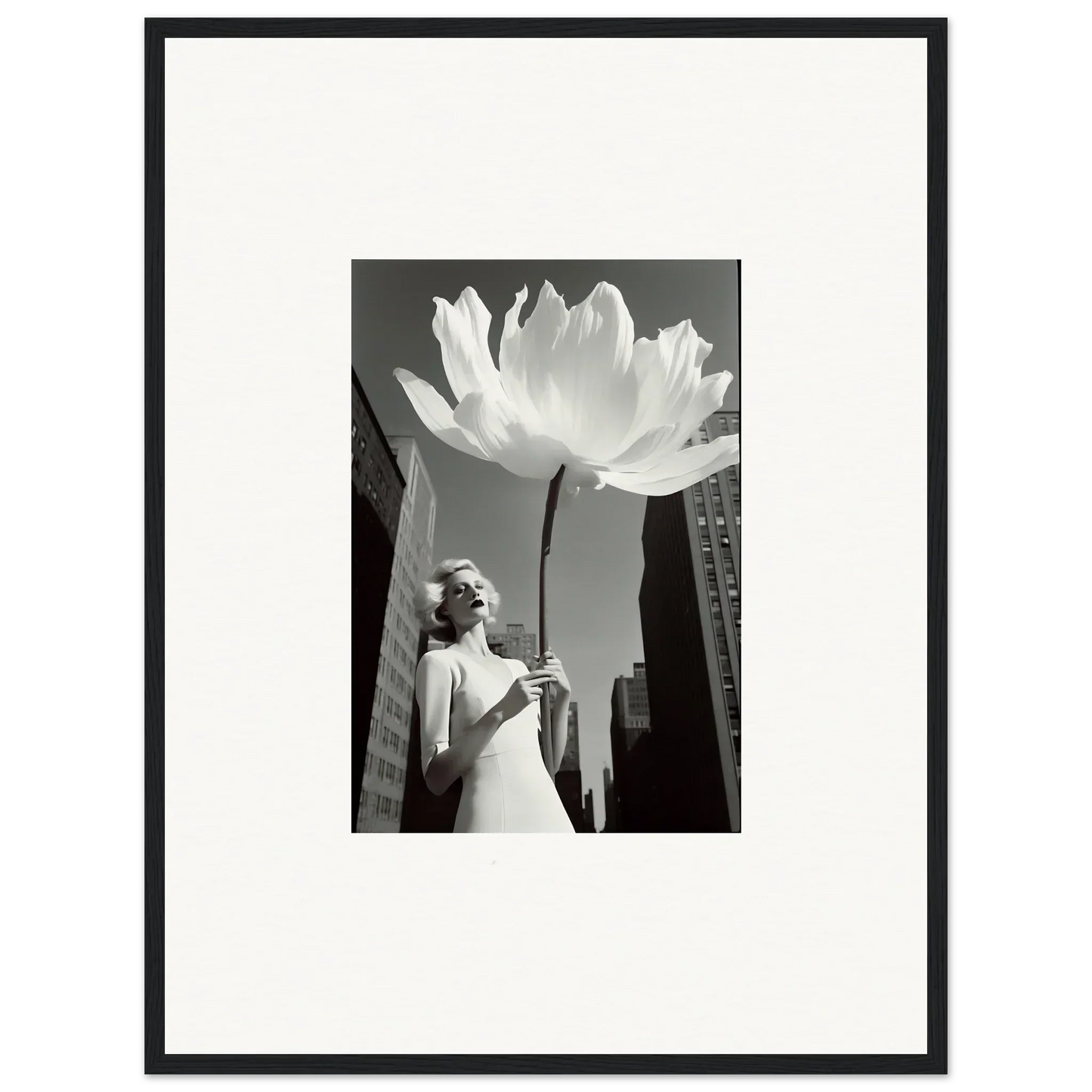 Black and white canvas print of a woman with a giant flower for a unique room decoration