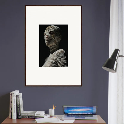 Framed black and white photograph of a sculptural bust with textured surface details.