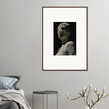 Framed black and white photograph of an ancient stone bust or sculpture.