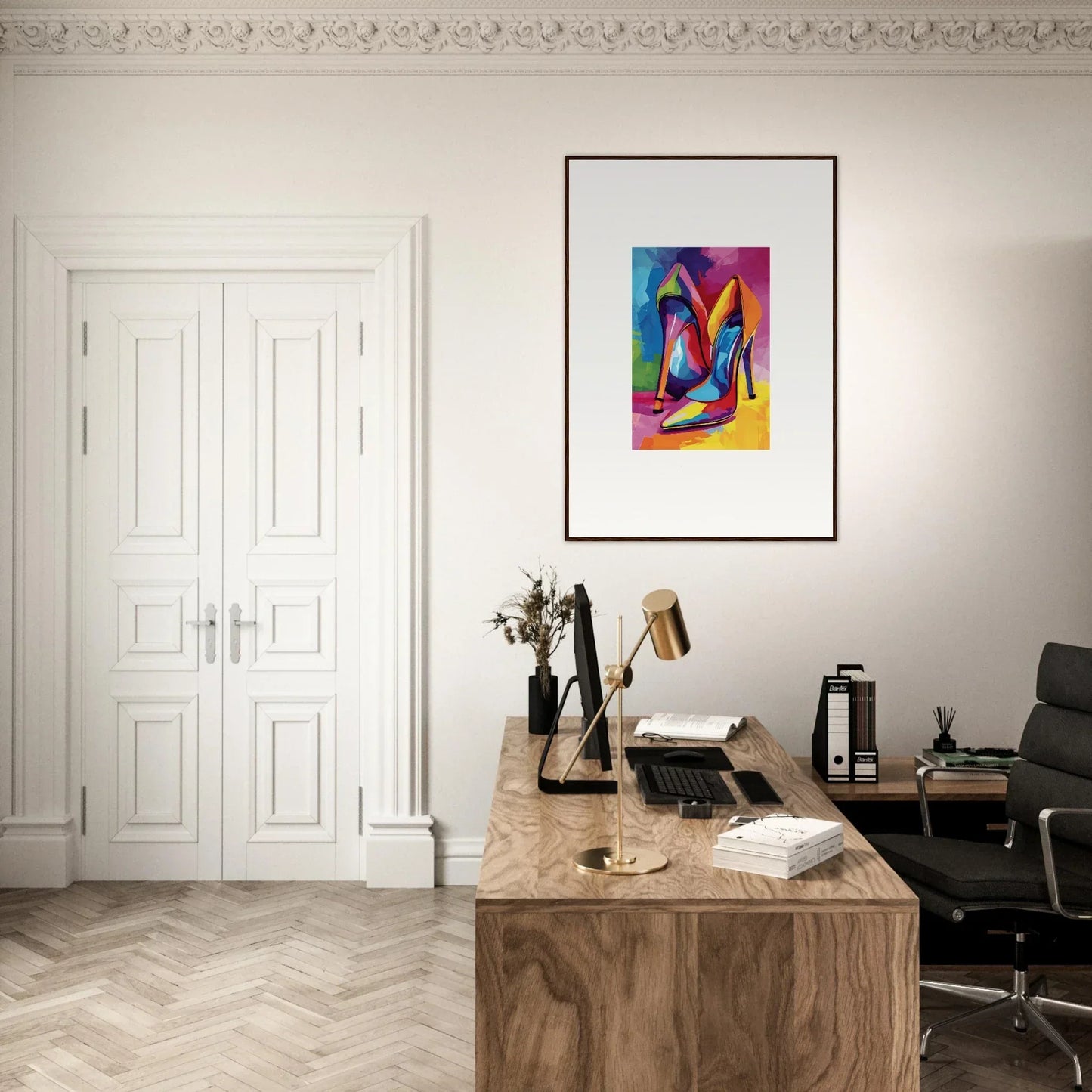 Home office workspace with wooden desk, chair, and colorful framed wall art decor