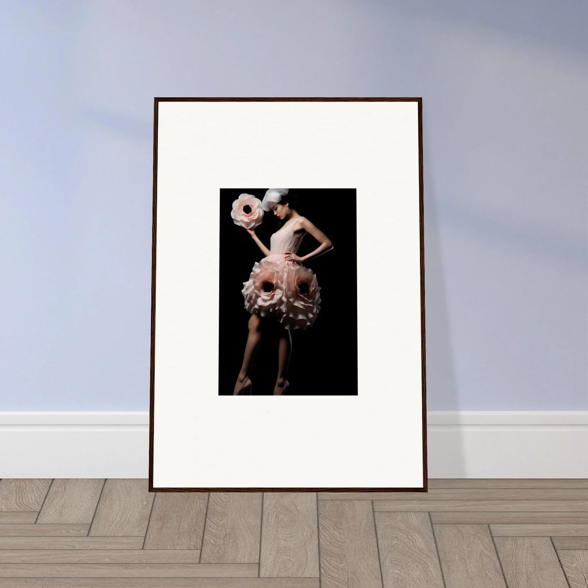 Framed wall art of a dancer in a feathered costume adds elegance to room decor