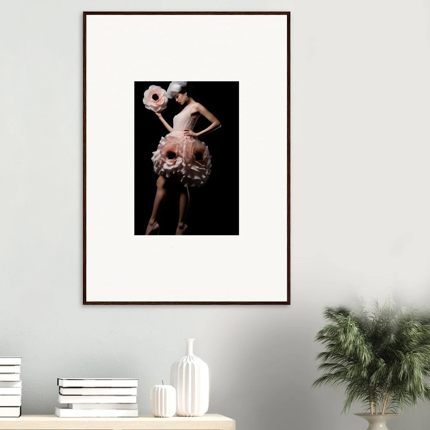 Framed wall art of a figure in a floral costume, perfect for chic room decor