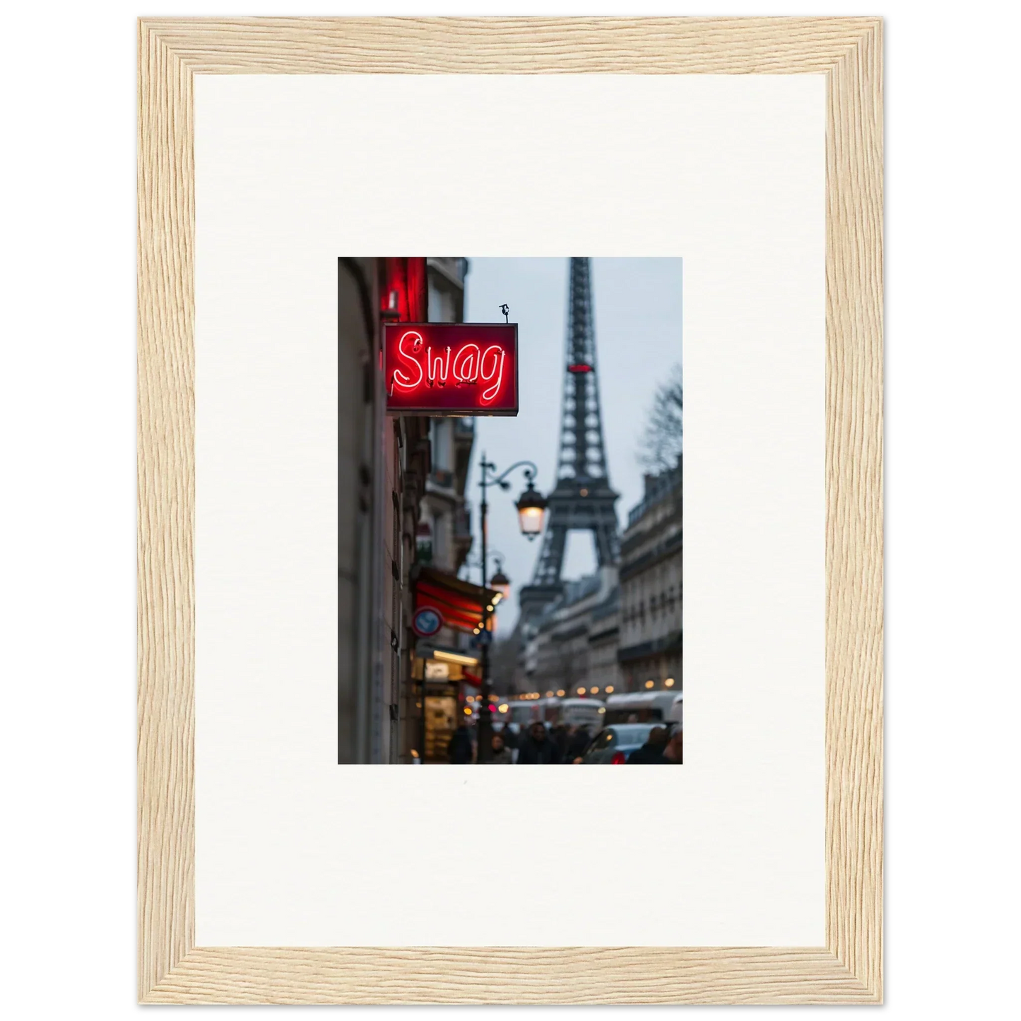 Framed wall art of a Parisian street with the Eiffel Tower and neon Swag sign for tour sentiments