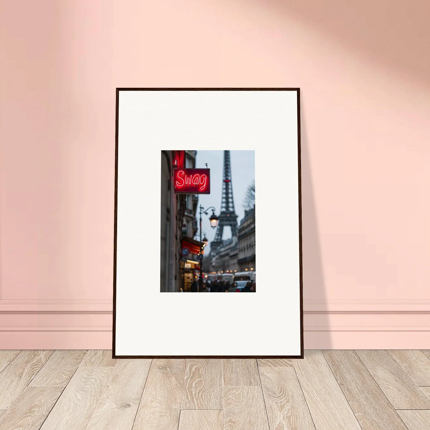 Framed wall art of a Parisian street scene with Eiffel Tower and neon Souvenirs sign