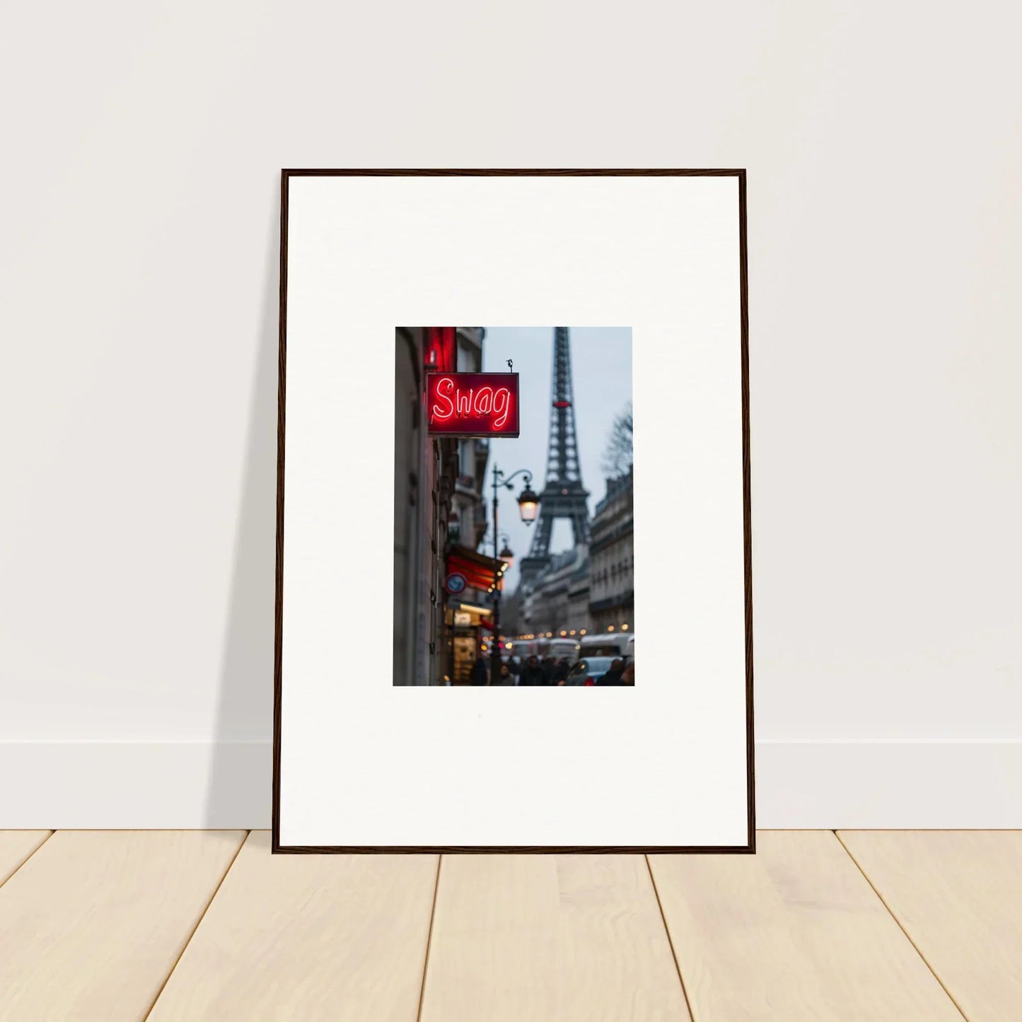 Framed wall art of a Parisian street with the Eiffel Tower and a neon Sexy sign