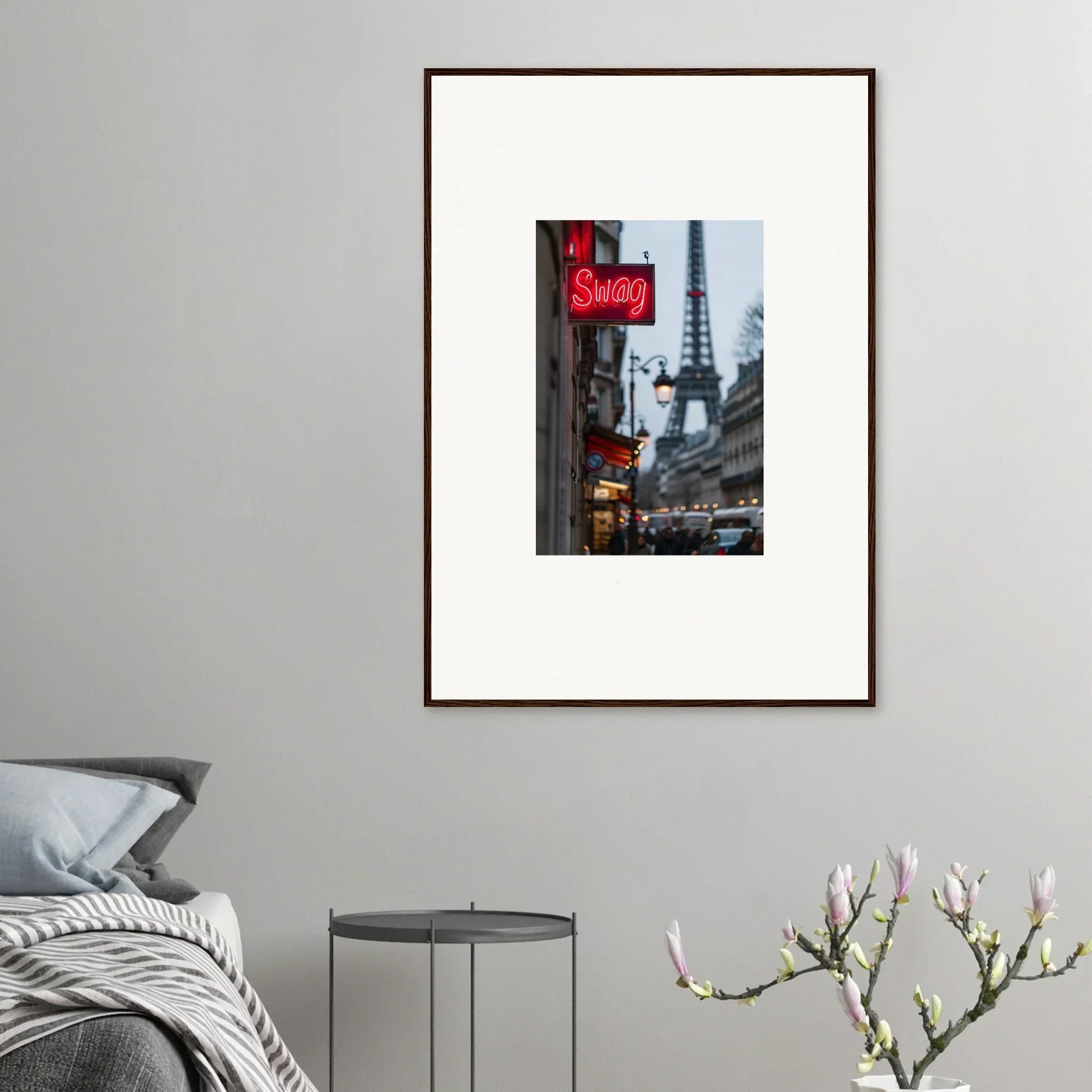 Framed wall art of a Parisian street with Eiffel Tower and red Soldes sign