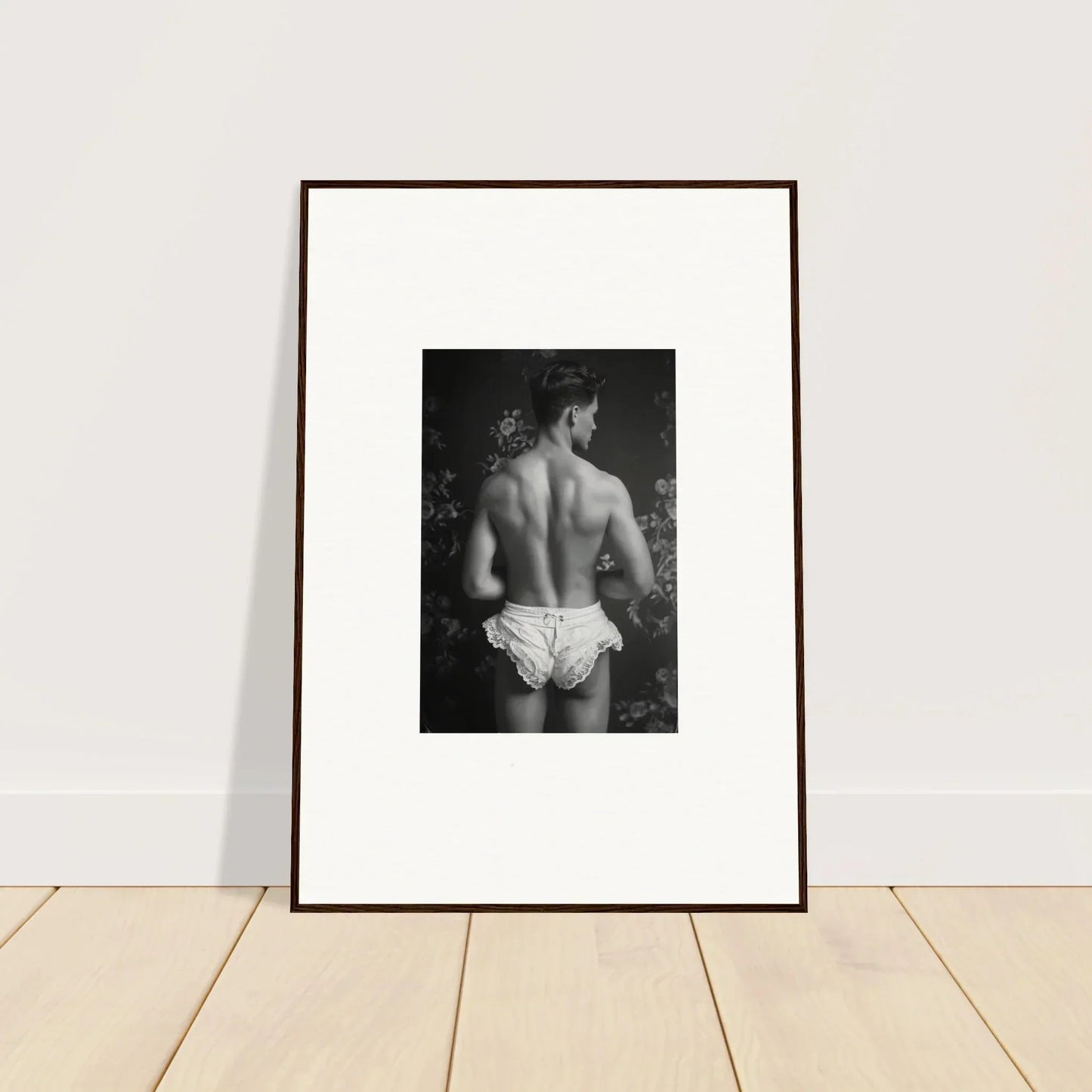 Framed black and white canvas print of a bare back in white underwear for chic wall art