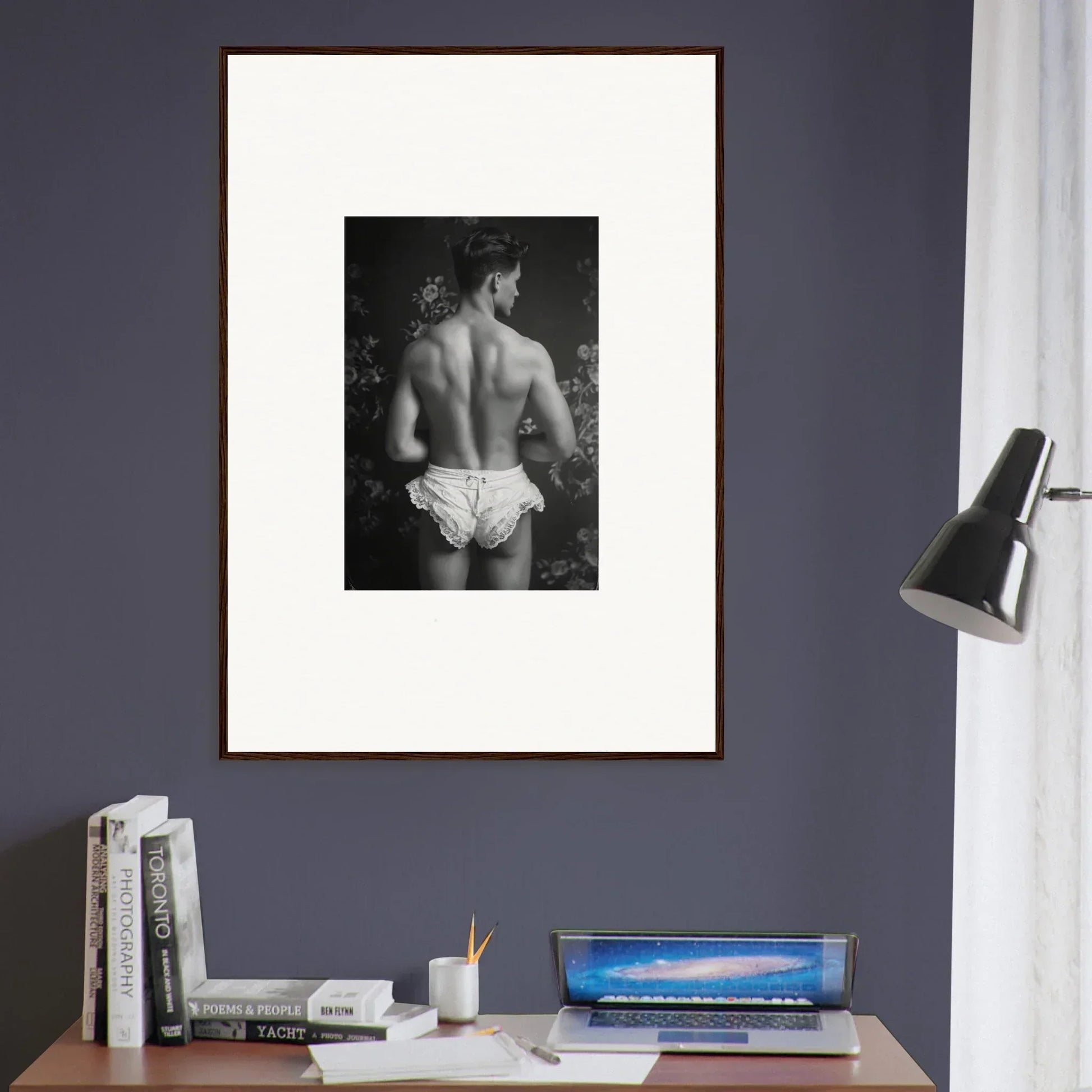 Framed black and white wall art of a person’s bare back in white underwear for room decoration