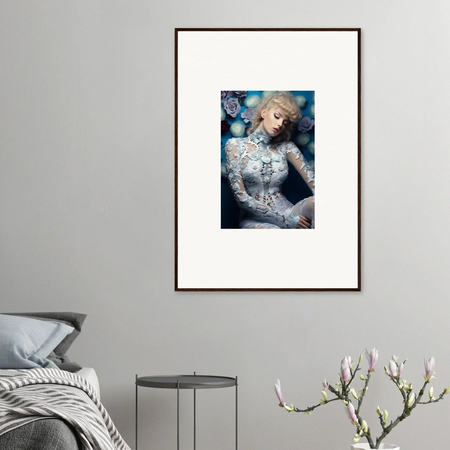 Framed portrait of a woman with blonde hair wearing an intricate white lace top.